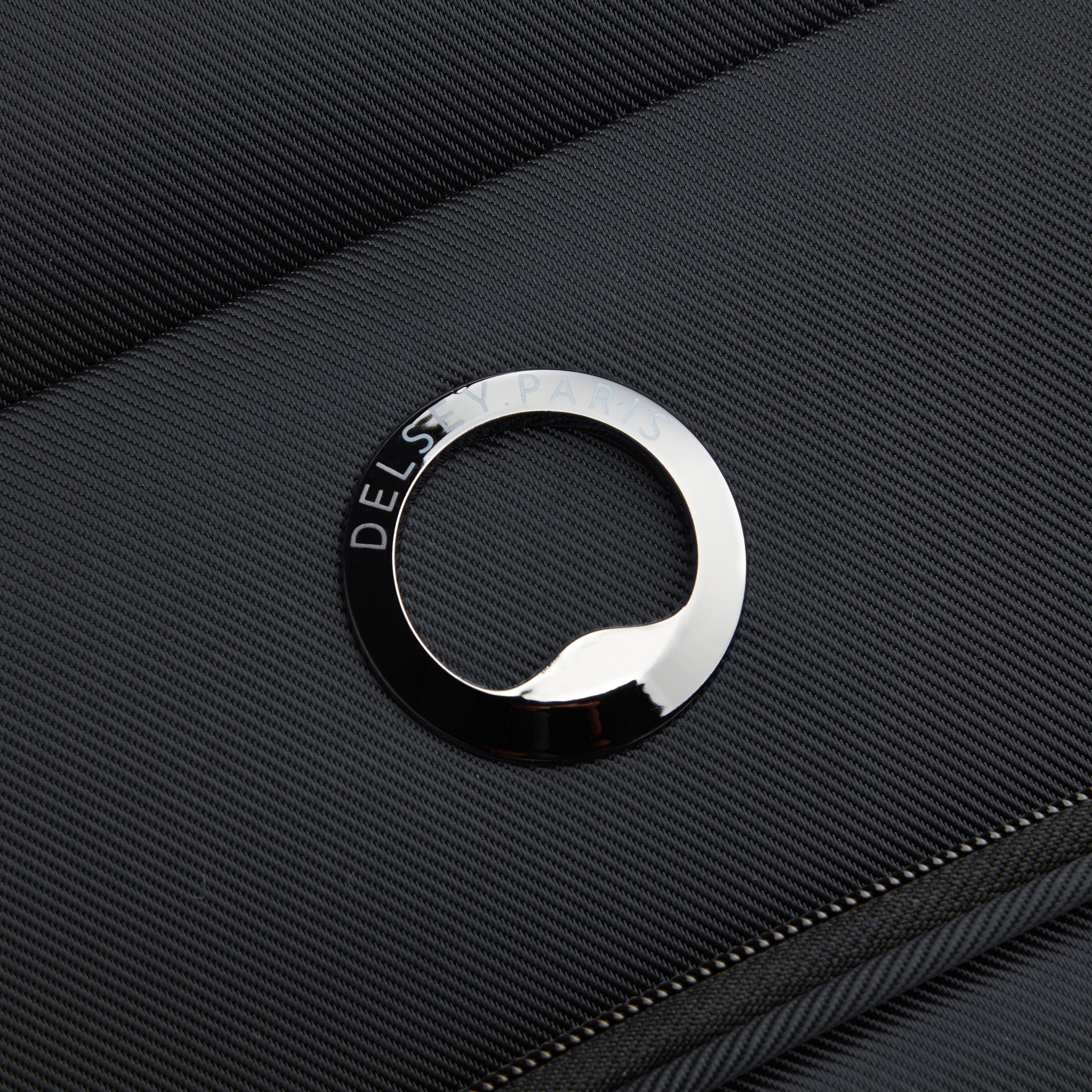Delsey Paris Sky Max 2.0 70.5cm Medium Expandable Check-in Suitcase in Black- logo close up